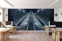 A contemporary living room with a large subway wall mural.

