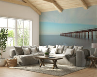 A contemporary living room with a large serene wharf wall mural.

