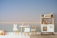 A living room featuring the scenic Dead Sea wall mural.

