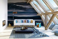 A contemporary living room with a large ocean wave wall mural.

