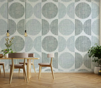 A graceful subtle circle wall mural in cool, light tones.

