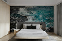 An artistic seaside scene mural on minimalist wallpaper.

