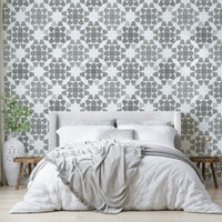 A graceful subtle geometric wall mural in cool, gray tones.

