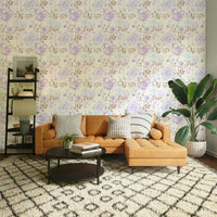A graceful subtle bloom wall mural in soft, purple tones.

