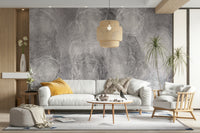 An artistic moody cloudscape mural on minimalist wallpaper.

