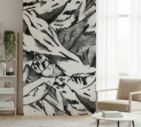 A peaceful mountain range mural on decorative wallpaper.

