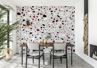An artistic shattered glass mural on minimalist wallpaper.
