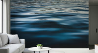 Wall mural with flowing deep blue waters creating a relaxing and immersive interior atmosphere.