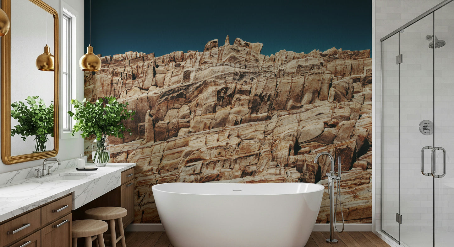 Dramatic cliff wall mural in deep terracotta and muted earth tones for accent walls in living spaces.