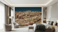 Rustic terracotta cliffscape wallpaper mural bringing outdoor textures and warm tones indoors.