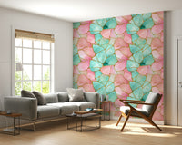 Elegant wallpaper featuring swirling pink and turquoise water with gold accents