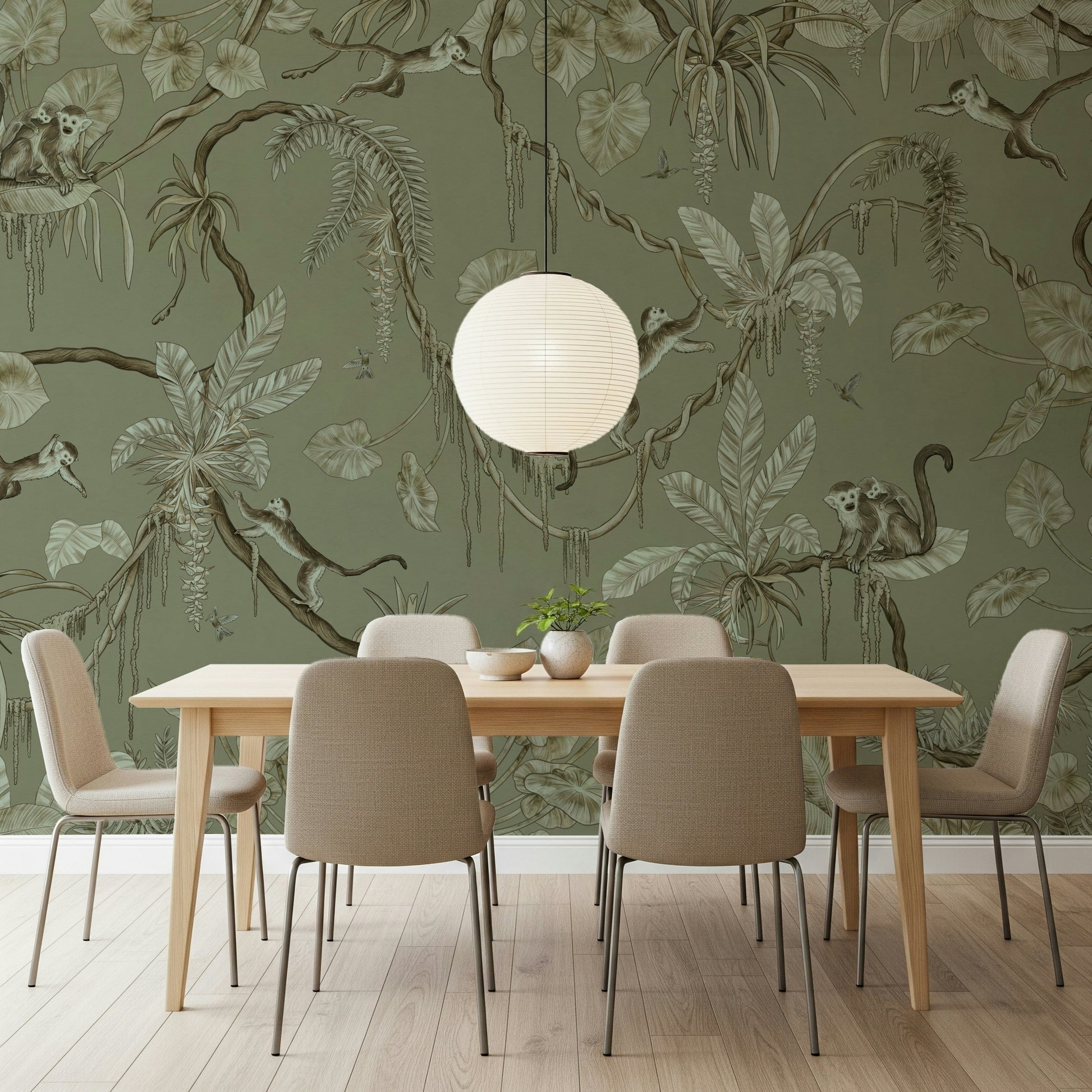 Nature-inspired wall art with monkeys perched on leafy jungle branches