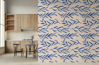 Stylized blue leaf and floral pattern creating a serene wall backdrop.