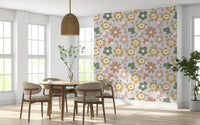 Retro floral blooms scattered across a light background create a warm bohemian wallpaper look.