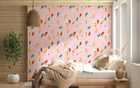 Playful string lights in red, yellow, green, and cream looping across a soft pink wallpaper.