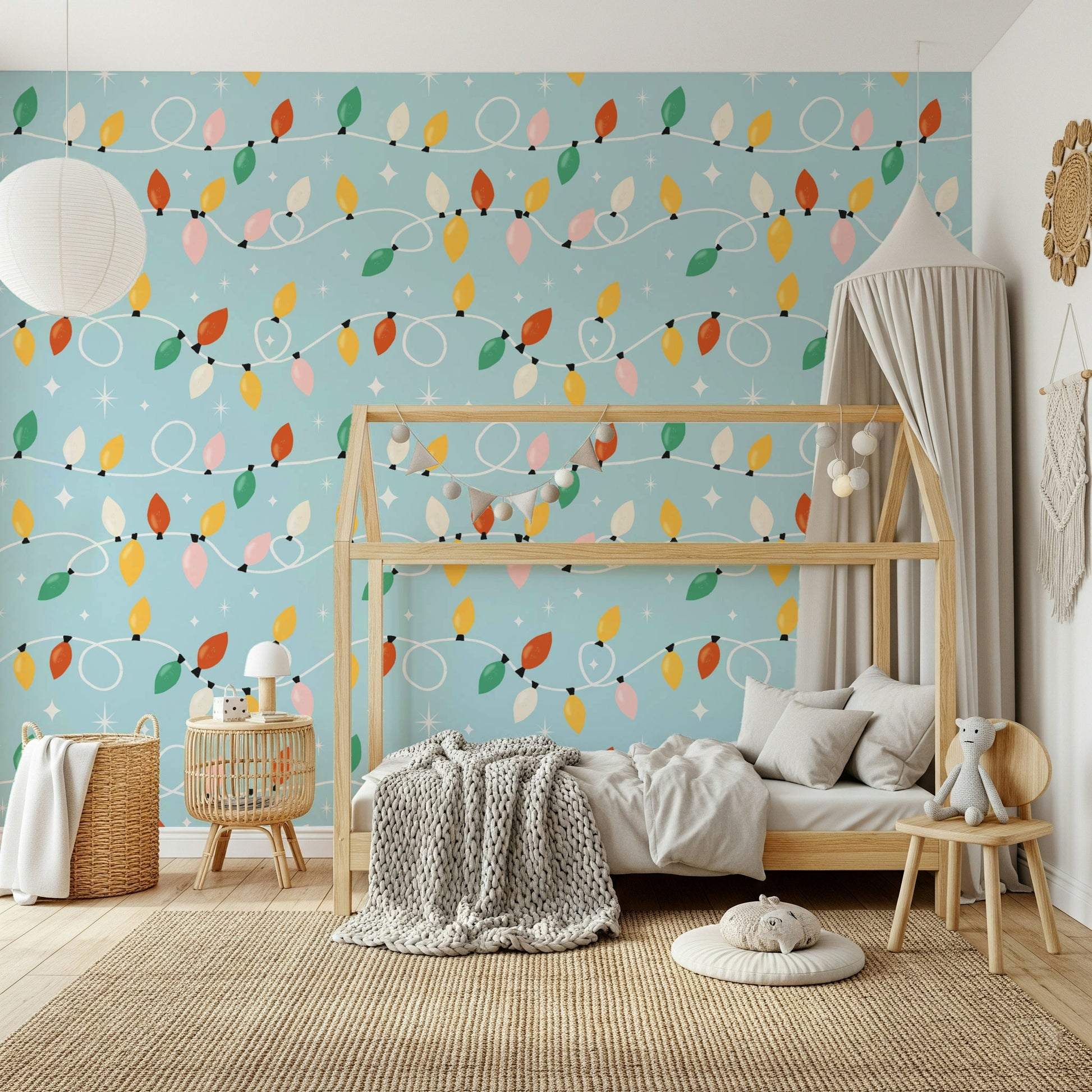 A whimsical wallpaper showcasing vibrant Christmas lights and star accents over a light blue base.