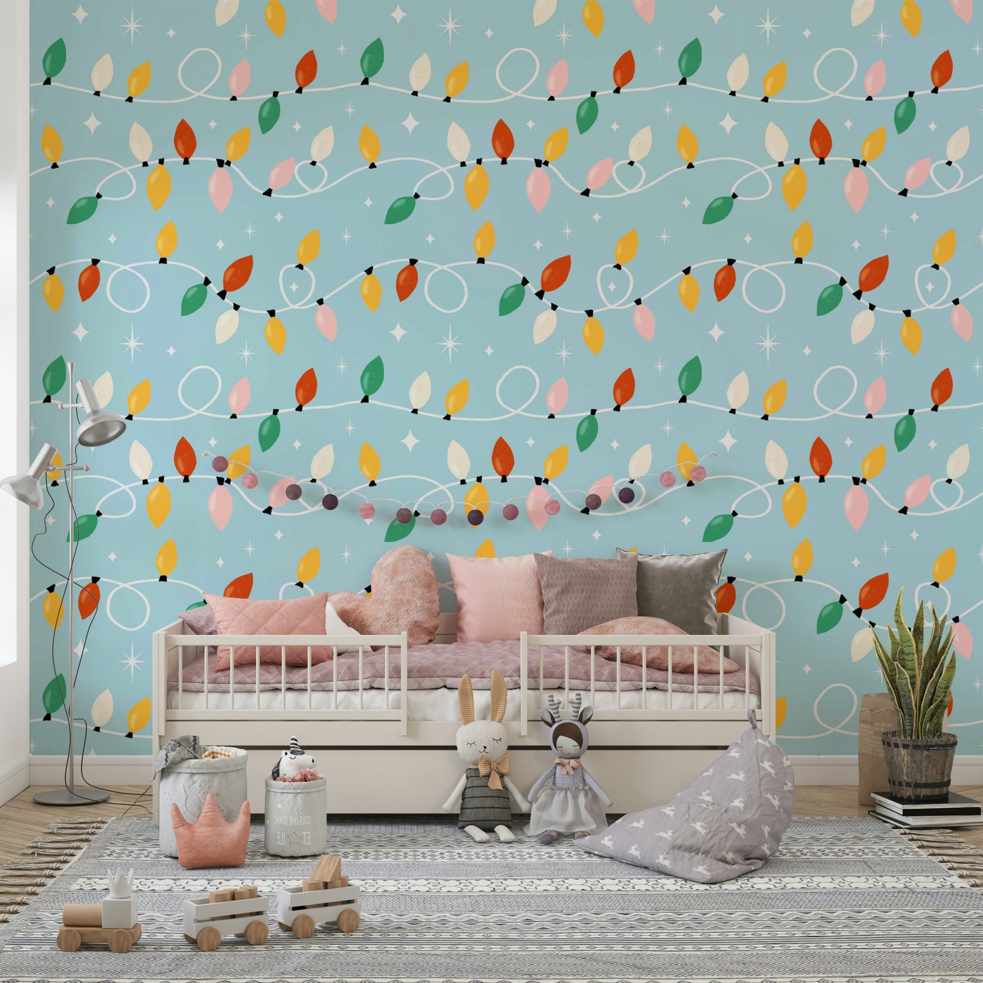 A festive wallpaper featuring colorful holiday lights strung across a soft blue background with sparkling stars.