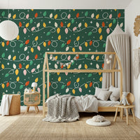 Vintage-style Christmas lights looping across a dark green wallpaper in cheerful holiday colors.
