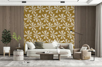 Vintage-style wallpaper showcasing radiating floral bursts on a textured mustard backdrop.