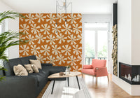 Vintage geometric floral wallpaper showcasing radiating petal shapes in a retro color palette.