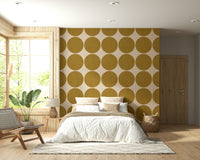 Modern geometric wallpaper with oversized ochre dots arranged in a uniform repeating grid