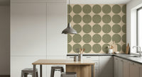 Modern geometric wallpaper with oversized olive circles arranged in a clean repeating grid