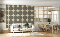 Repeating pattern of soft green circular shapes with a woven texture on an off-white backdrop