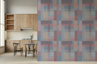 Muted block shapes blending into each other to form a calming geometric wallpaper design.