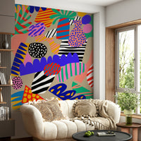 Jungle-themed wallpaper showcasing vivid stripes, polka dots, and bold organic silhouettes.