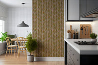 A warm beige wallpaper decorated with repeating retro leaves arranged along thin vertical vines.