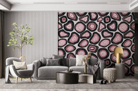 A seamless wallpaper with pink geode-style formations outlined in bold dark rings.