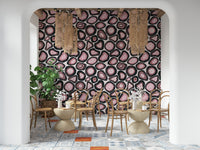 Bold pink agate formations outlined in deep black creating a dramatic mineral wallpaper.