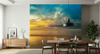 Warm sunlight breaking through thick clouds over a reflective shore in a stunning Borneo Beach wallpaper.