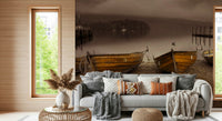 Rustic lakeside wallpaper with weathered wooden boats and a peaceful sepia landscape.