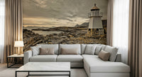 Lighthouse mural featuring a quiet coastal scene framed by mountains and drifting clouds.