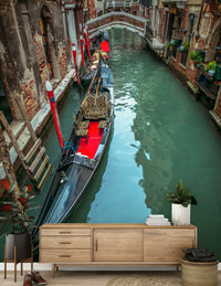 Gondola resting in canal mural, charming bridge spanning water.