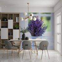 Dried lavender sprigs standing inside a shiny silver bucket accent image.