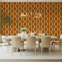 Warm ochre wall mural with beige wavy stripes and distressed texture.