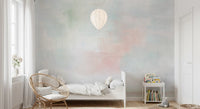 Abstract sky-inspired mural with faded blue, white, and pink tones