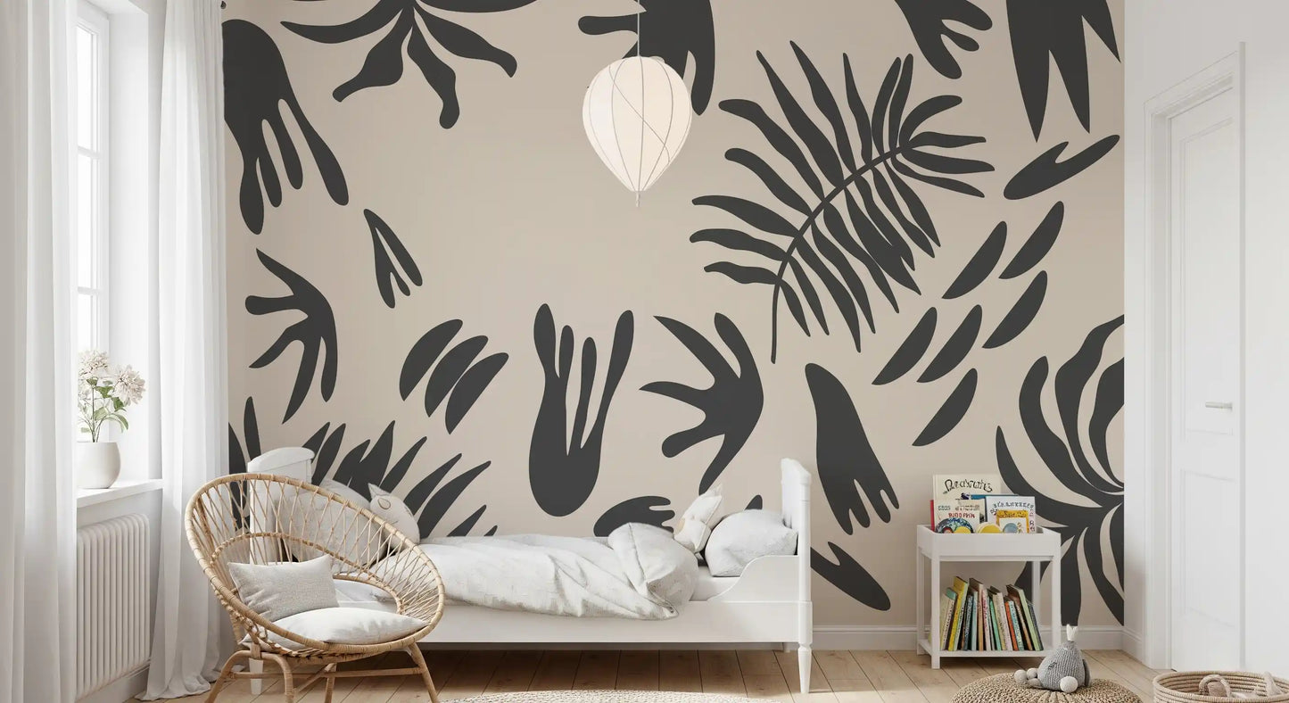 Beige botanical wall mural styling a nursery with flowing charcoal fronds