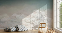 Minimal blue sky wall mural with soft clouds across a hallway wall