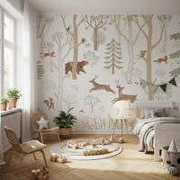 Green forest wall mural in a bedroom with deer, foxes, rabbits, and foliage
