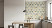 Kitchen and dining area carry deco foliage wallpaper with a dusty blue-grey base