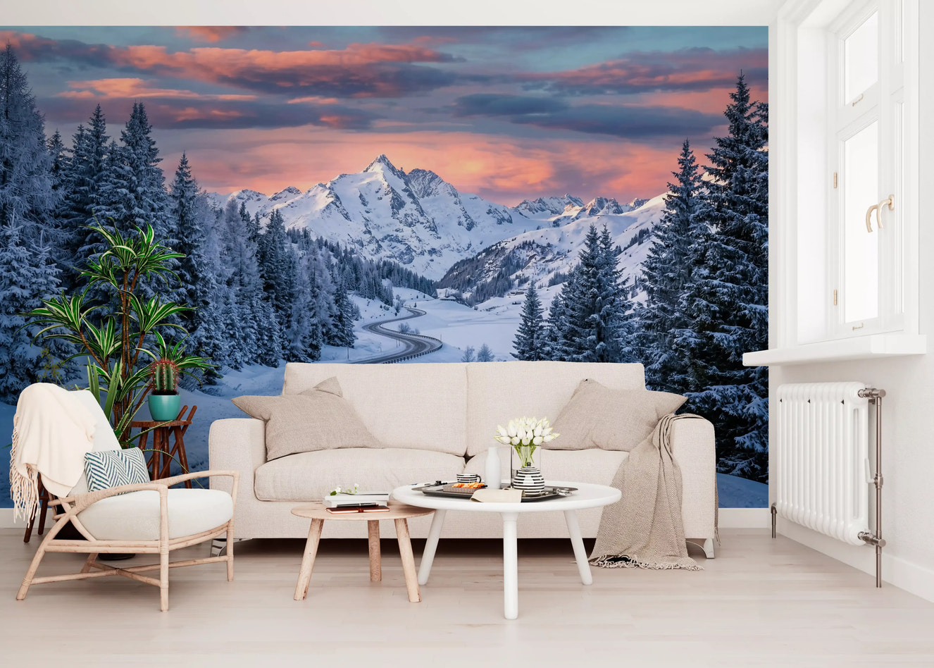 In the Living room, a snowy alpine drive wall mural frames frosted mountain sunset views ahead