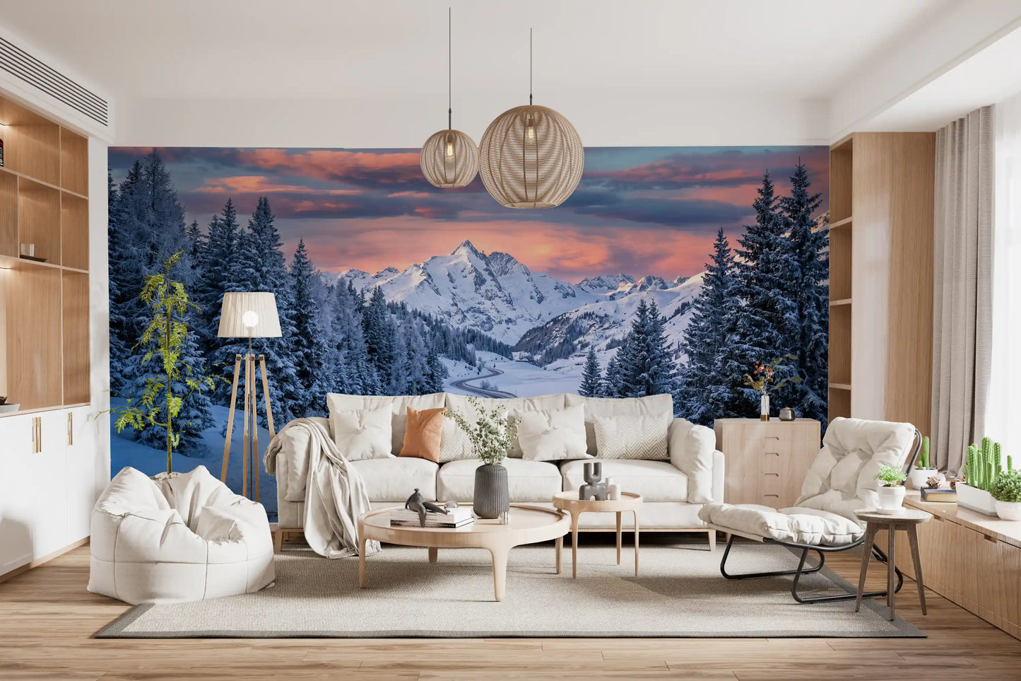 Lounge area wall mural showcases winter route scenery beneath alpine sunset peaks