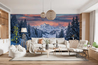 Lounge area wall mural showcases winter route scenery beneath alpine sunset peaks