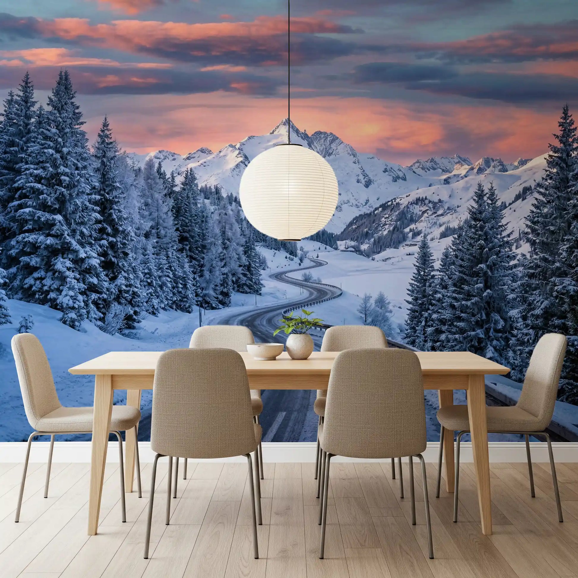 Across the Dining space, a snowy alpine drive wall mural adds rose-toned sky glow above