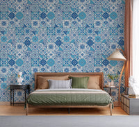 Mediterranean blue tile wallpaper in a bedroom with floral motifs