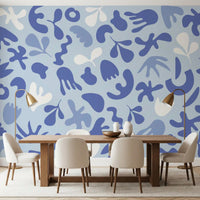 Dining room styled using Periwinkle Cut wall mural with flowing blue shapes