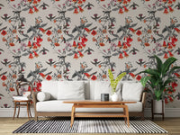 Delicate hummingbirds sweep through Crimson Aviary wallpaper with muted leaves